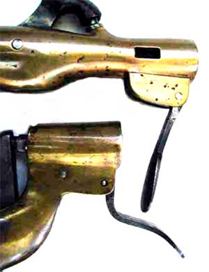 The combination locking and ejecting levers in their forward position.